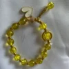 Yellow kids charm bracelet with heart