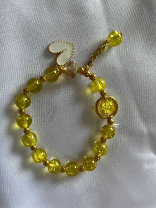 Yellow kids charm bracelet with heart