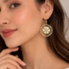 Model wearing floral crystal round earrings